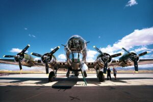 Low angle shot of a B-17 bomber plane from WWII captured on an airbase on a sunny day
